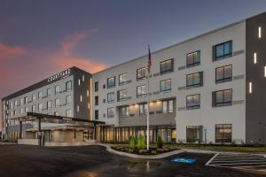 a rendering of the exterior of a hotel at Courtyard by Marriott Conway in Conway