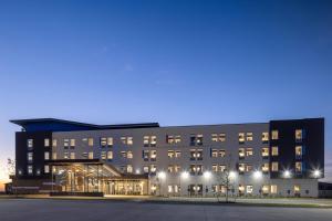 a rendering of a building at night at Aloft Oklahoma City Quail Springs in Oklahoma City