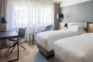 Voodi või voodid majutusasutuse Basel Marriott Hotel toas