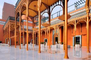 a large building with columns and arches in a courtyard at Cairo Marriott Hotel & Omar Khayyam Casino in Cairo