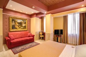 TV a/nebo společenská místnost v ubytování Aurelius Art Gallery Hotel