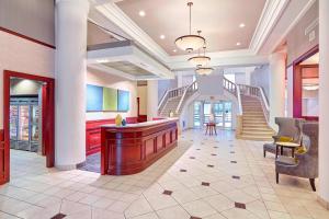 a lobby of a hotel with stairs and a bar at Residence Inn Milwaukee Downtown in Milwaukee