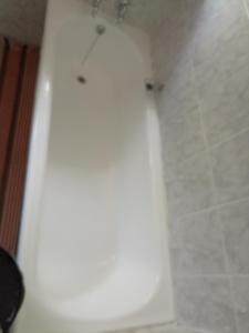 a white bath tub in a bathroom at Gilgal Abode in Secunda