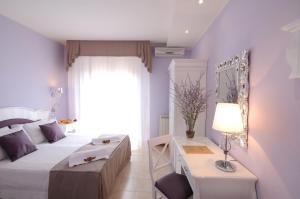 Voodi või voodid majutusasutuse Hotel I Due Cigni toas