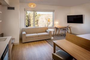 a living room with a couch and a table at Element Bend in Bend