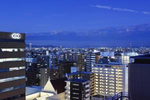 a view of a large city at night at Courtyard by Marriott Shin-Osaka Station in Osaka