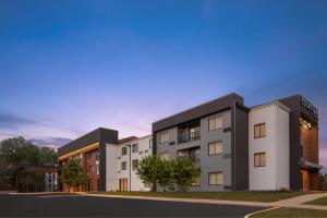 a rendering of the exterior of a building at Courtyard Detroit Brighton in Brighton