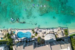 an aerial view of a resort and the beach at Grand Cayman Marriott Resort in George Town