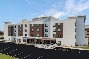 a rendering of the front of a hotel with a parking lot at TownePlace Suites by Marriott Sidney in Sidney