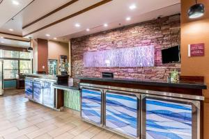 a bar in a hotel lobby with a brick wall at Fairfield Inn & Suites by Marriott Alamogordo in Alamogordo