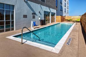 a swimming pool in front of a building at SpringHill Suites by Marriott Amarillo in Amarillo