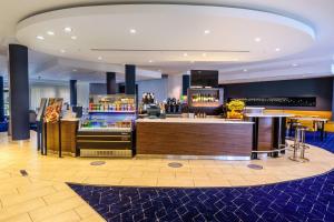 a bar in a hotel room with a counter at Courtyard by Marriott Wilkes-Barre Arena in Wilkes-Barre