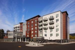 a rendering of a hotel building with a parking lot at TownePlace Suites by Marriott West Kelowna in West Kelowna