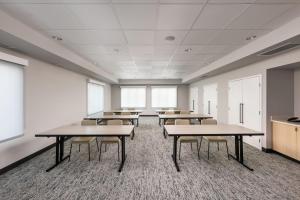 a classroom with tables and chairs in a room at TownePlace Suites by Marriott West Kelowna in West Kelowna +27 photos