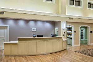 a lobby of a hospital with a reception counter at Residence Inn by Marriott Norfolk Airport in Norfolk