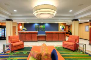 a lobby with two chairs and a waiting room at Fairfield Inn & Suites Laredo in Laredo