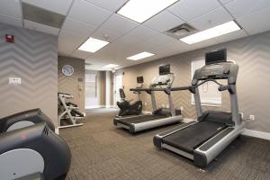 a gym with treadmills and ellipticals in a room at Residence Inn by Marriott Charlotte Piper Glen in Charlotte