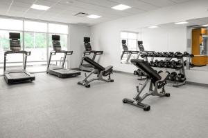 a gym with several exercise bikes in a room at SpringHill Suites by Marriott Charlotte Airport Lake Pointe in Charlotte