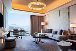 a living room with a couch and a table at JW Marriott Hotel Macau in Macau