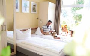 Postel nebo postele na pokoji v ubytování Aparthotel Seepanorama + 14 fotografií