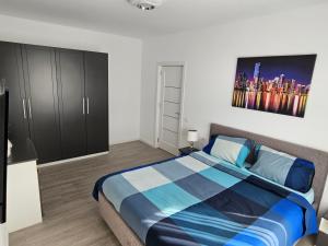 Кровать или кровати в номере Apartament Ștrand