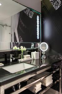 a bathroom with a sink and a mirror at Renaissance Cincinnati Downtown Hotel in Cincinnati