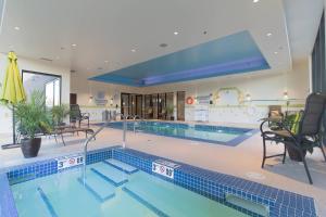 a large swimming pool in a building at Fairfield Inn & Suites by Marriott Regina in Regina