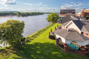 an aerial view of a building next to a river at Courtyard La Crosse Downtown/Mississippi Riverfront in La Crosse