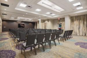 a room with rows of chairs in front of a screen at SpringHill Suites by Marriott San Jose Airport in San Jose