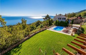an aerial view of a yard with a swimming pool at Nice Home In Lovran With Sauna in Lovran