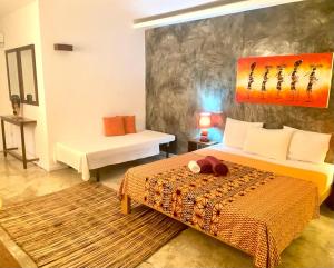Postel nebo postele na pokoji v ubytování Hotel Kriola