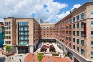 an exterior view of a building with a courtyard at Residence Inn by Marriott Richmond Downtown in Richmond