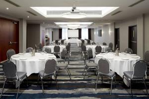 a conference room with white tables and chairs at Fairfield Inn & Suites by Marriott Montreal Airport in Dorval +20 photos