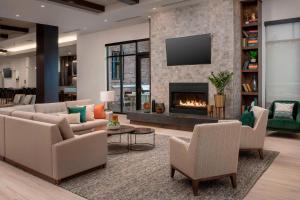 a living room with couches and a fireplace at Residence Inn By Marriott Bend in Bend