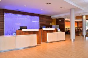 an office with a large screen in the middle of a lobby at Fairfield Inn and Suites by Marriott Calhoun in Calhoun