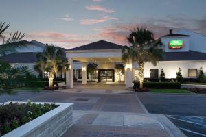 a hotel with a sign on the front of it at Courtyard by Marriott Waco in Waco