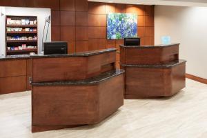 a lobby of a pharmacy with wooden walls at Courtyard by Marriott Waco in Waco