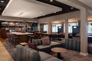 a restaurant with couches and tables and a bar at Courtyard by Marriott Los Angeles Hacienda Heights Orange County in Hacienda Heights