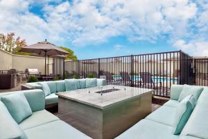 a patio with a table and chairs and a fence at TownePlace Suites by Marriott Sacramento Elk Grove in Elk Grove