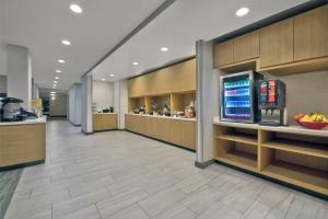 a lobby of a hospital with a counter and a drink at TownePlace Suites by Marriott Sacramento Elk Grove in Elk Grove