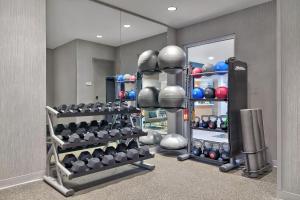 a gym with dumbbells and weights in a room at TownePlace Suites by Marriott Sacramento Elk Grove in Elk Grove