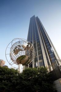 a sculpture of a world in front of a tall building at Trump International New York in New York
