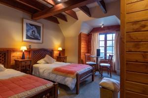 Postel nebo postele na pokoji v ubytování Petrohue Lodge