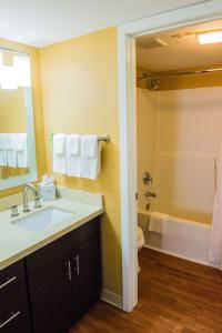 a bathroom with a sink and a toilet and a shower at MainStay Suites Houston NASA-Clear Lake in Webster