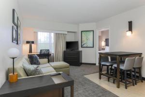 a living room with a couch and a table at Residence Inn Boulder Longmont in Longmont