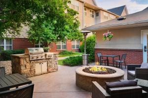a patio with a grill and a fire pit at Residence Inn Boulder Longmont in Longmont