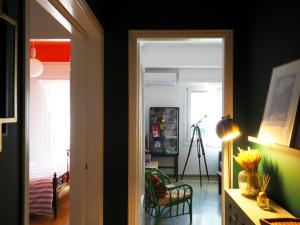 a hallway with a room with green walls at MimaDart Pop-up Gallery Apartment in Piraeus