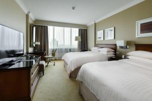 Cama ou camas em um quarto em Warsaw Presidential Hotel