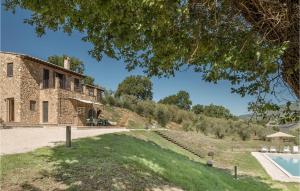 an external view of a stone house with a swimming pool at Nice Home In Lugnano In Teverina in Lugnano in Teverina
