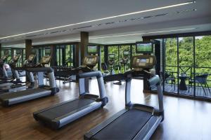 a gym with rows of tread machines in a building at Mulu Marriott Resort in Mulu